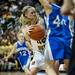 Manchester sophomore Maddie Collins tries to pass around a Saginaw Nouvel player on Saturday, March 16. Daniel Brenner I AnnArbor.com